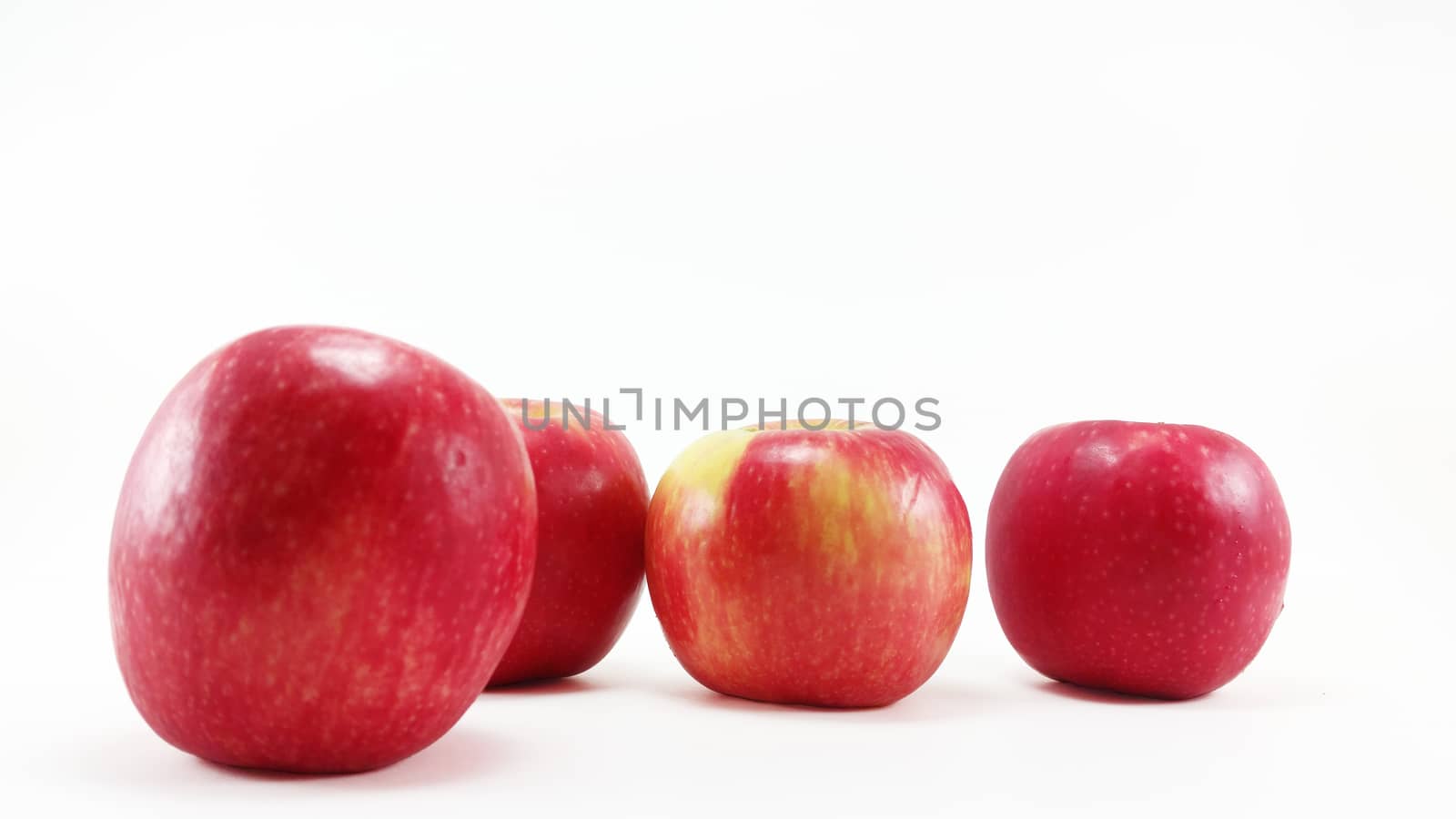 4 apples in white background with selective focus by arraymax
