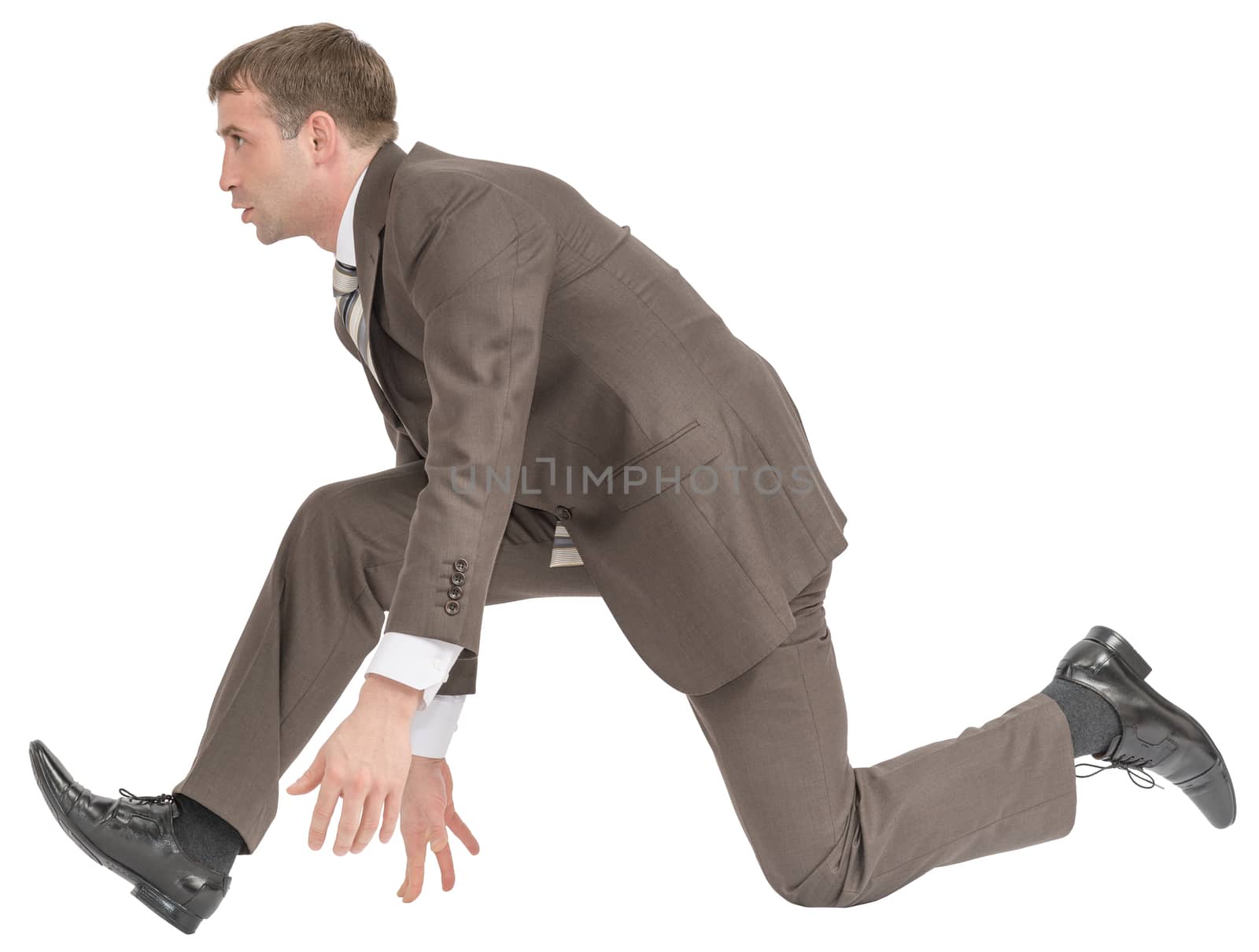 Businessman ready to race on isolated white background