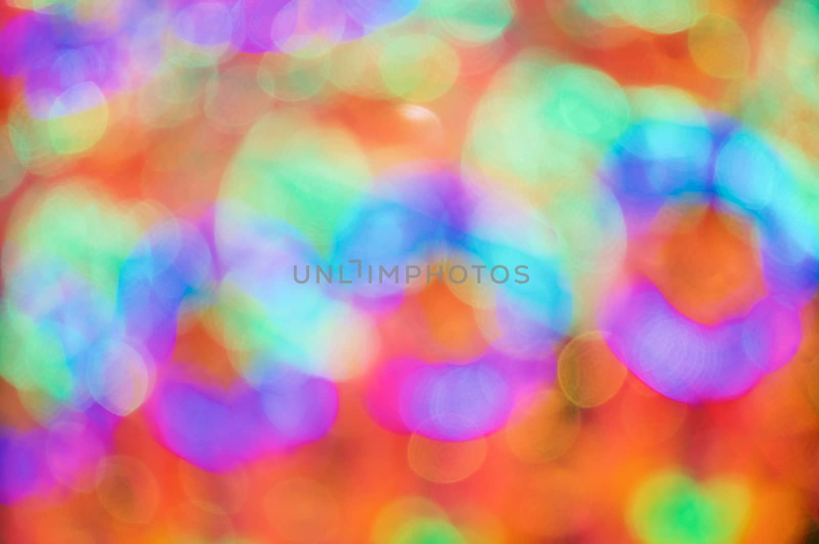 Defocused of glitter or orange and green bokeh circle at night as abstract background.