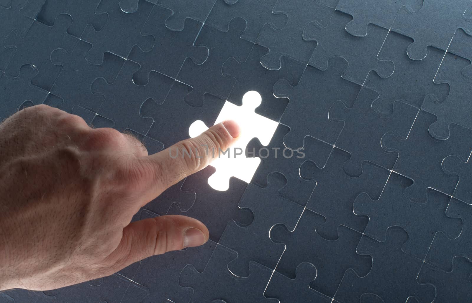 Missing jigsaw puzzle piece with light glow by cherezoff