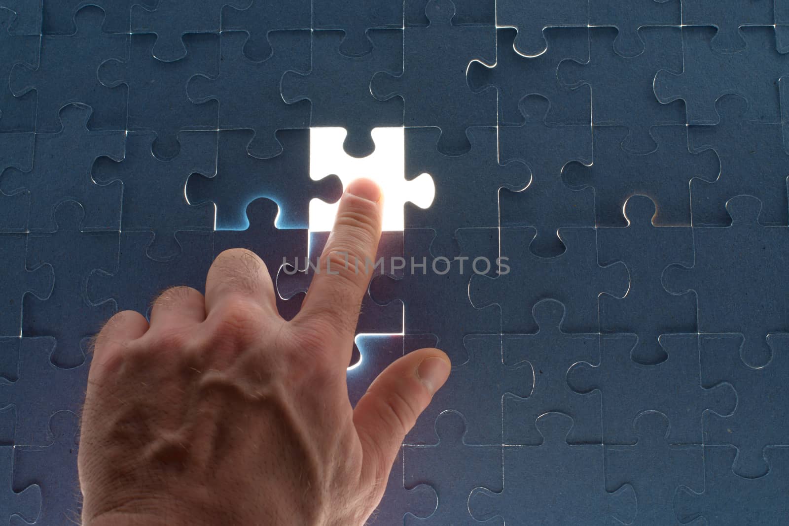 Missing jigsaw puzzle piece for completing the final puzzle piece, closeup