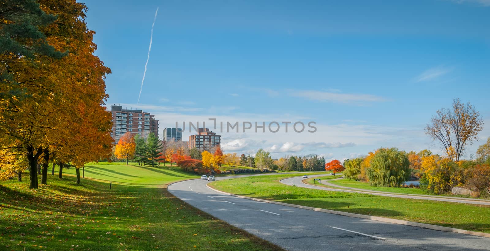 Ottawa parkway beside Ottawa River.  Apartment buildings & condominiums along the parkway - Urban Mechanicsville - panoramic view.  Clear sunshine. by valleyboi63