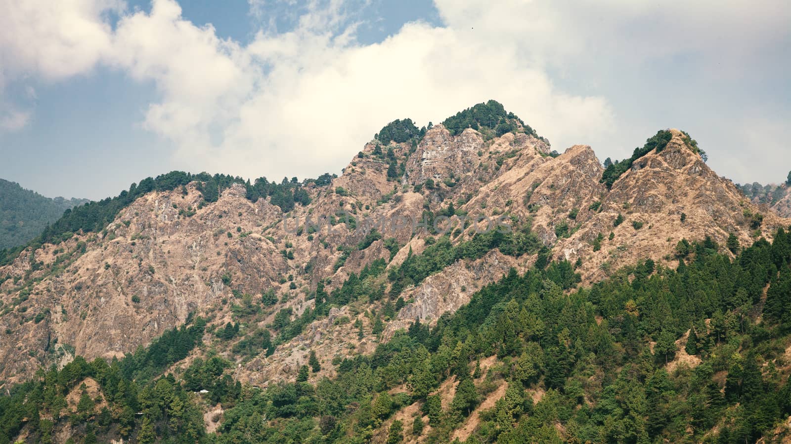 Landscape of rocky mountains ranges and forest of The Himalayas, Nepal.