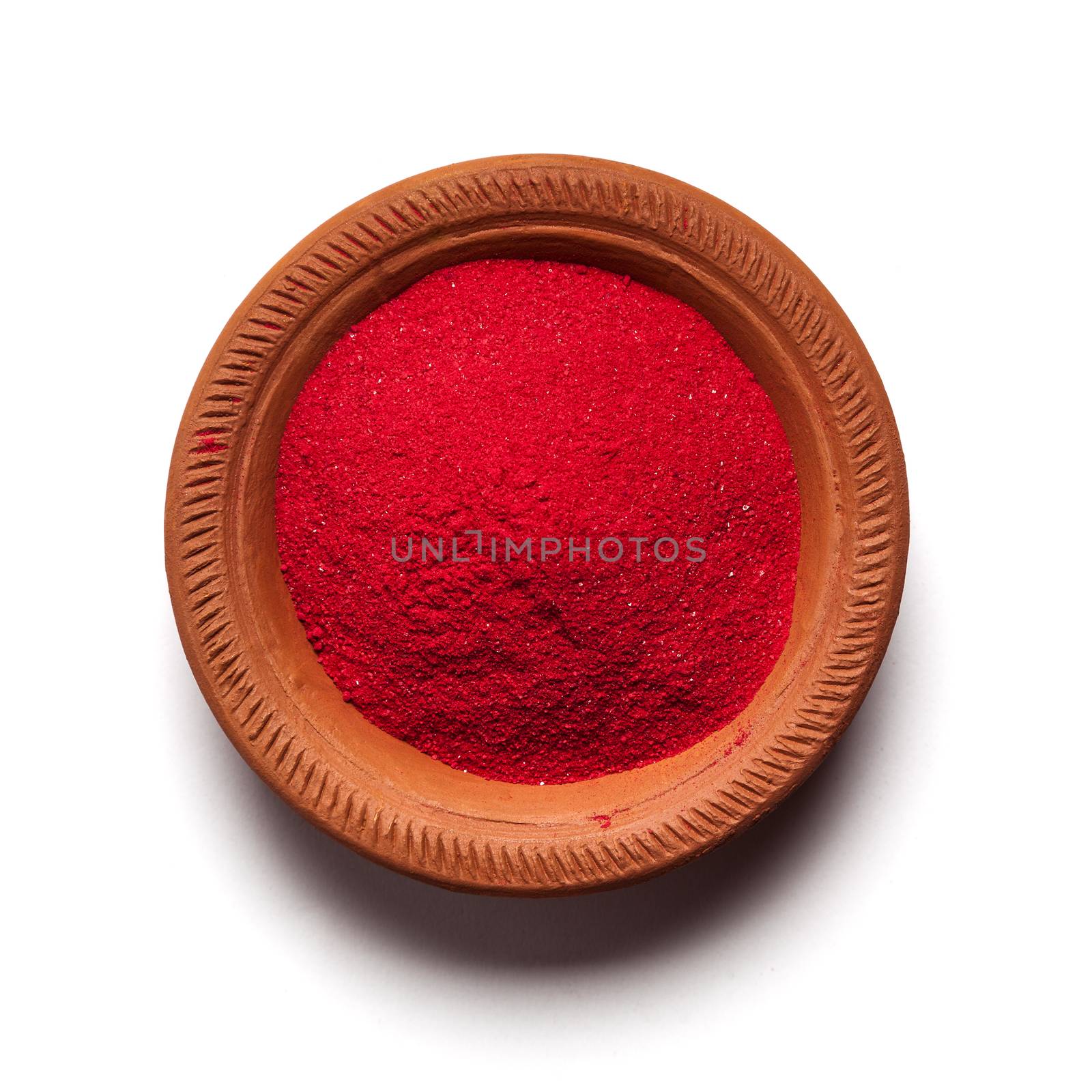 Top view close up of red color made of soil in clay pot on white background.