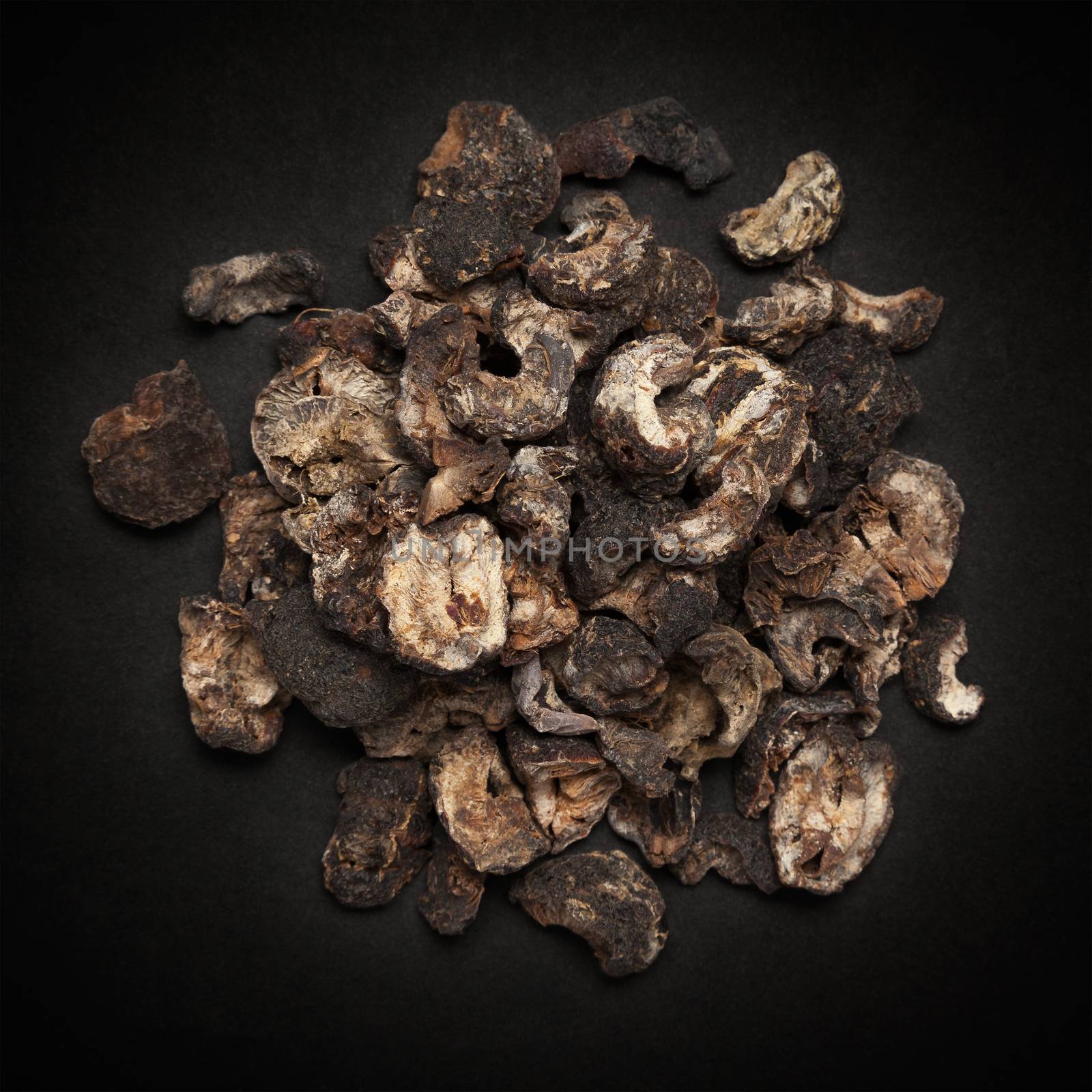 Top view of Organic Dried gooseberry or Amla (Ribes grossularia) isolated on dark background.