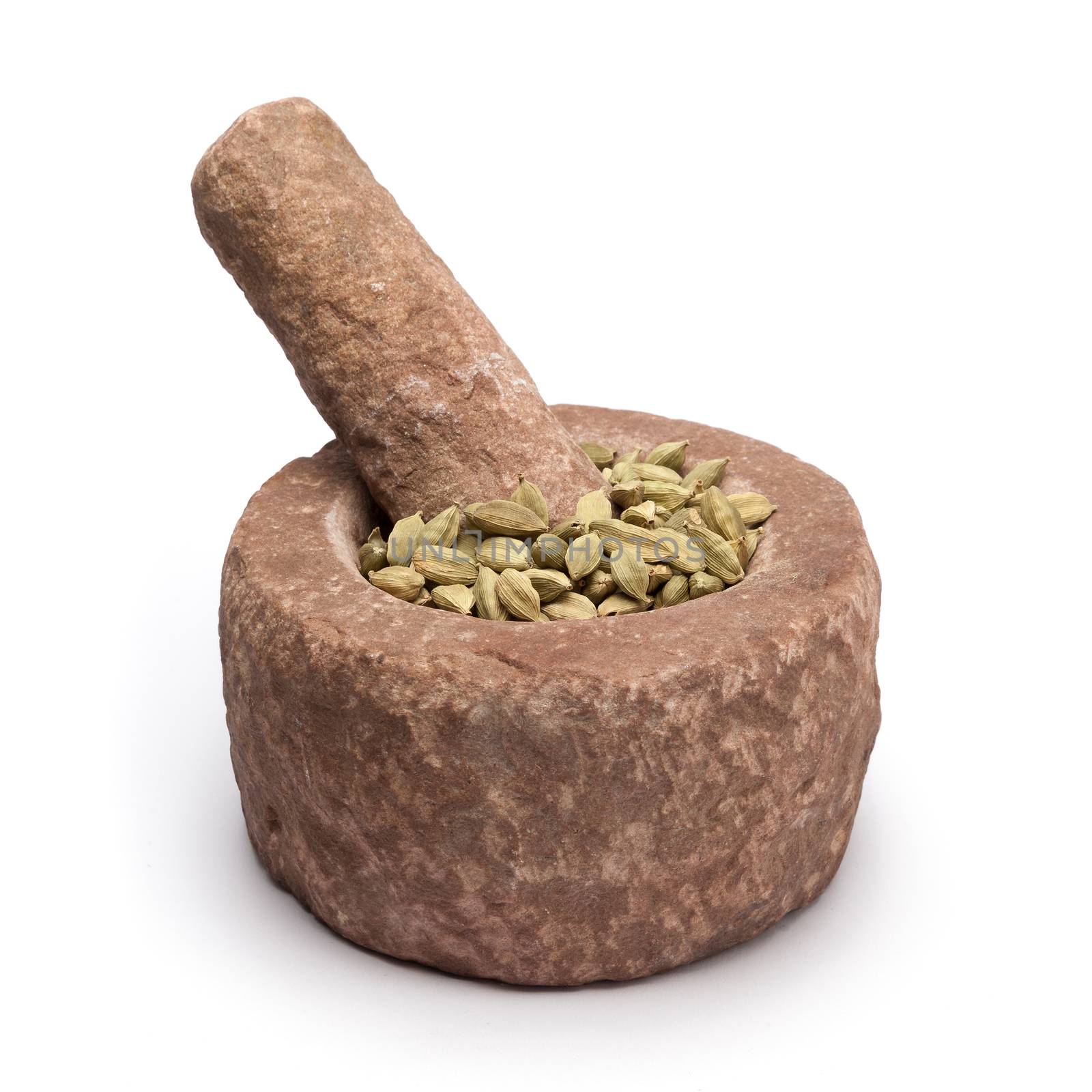 Organic Green or True cardamom (Elettaria cardamomum) in mortar with pestle, isolated on white background.