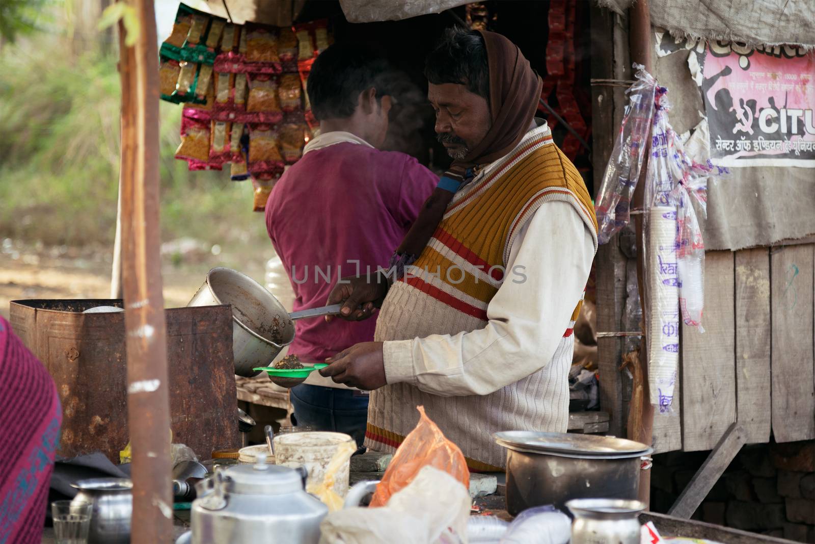 A Local street tea vendor preparing tea. Dec 13, 2015, Kanpur, India.