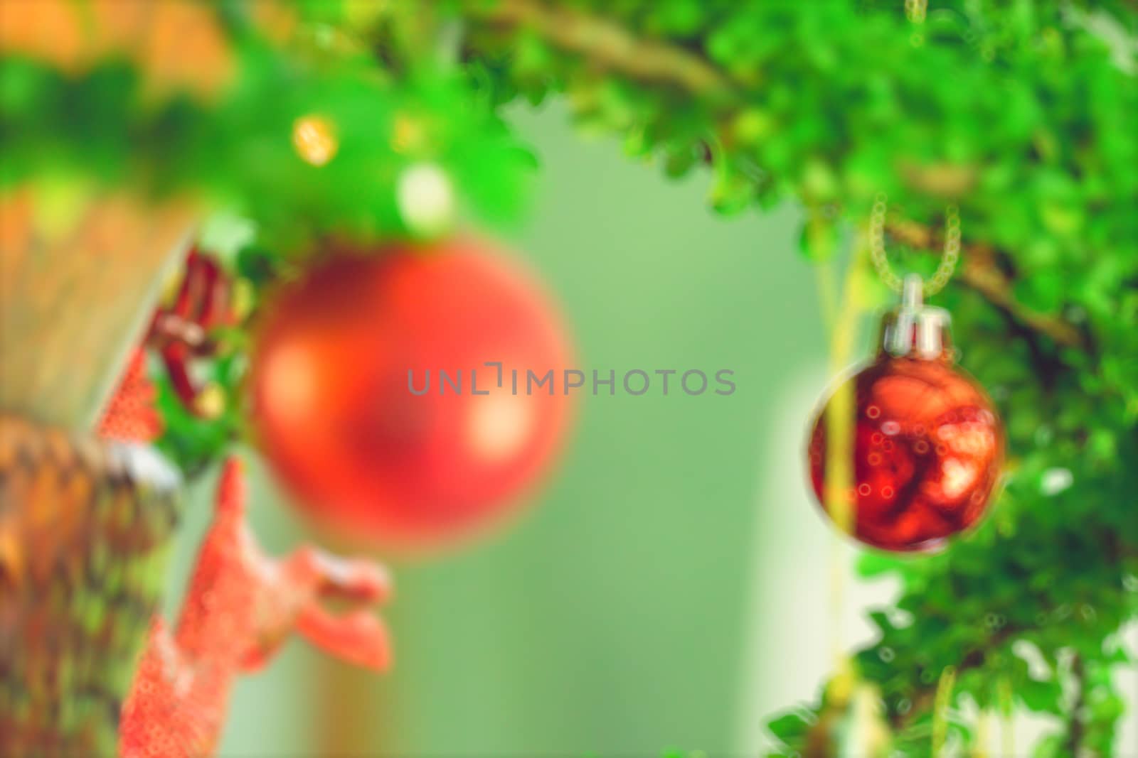 bokeh Christmas balls and Christmas tree with light background