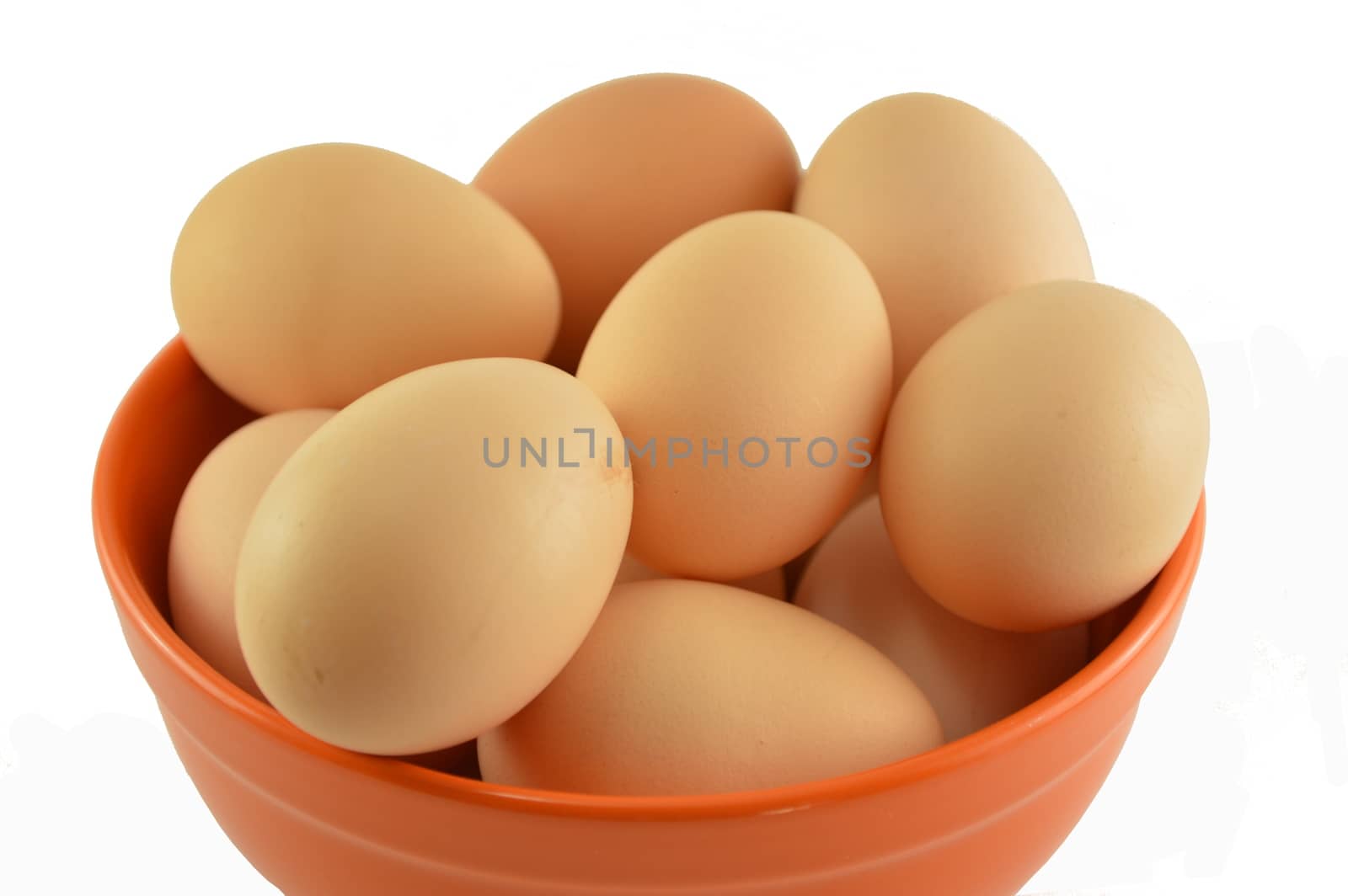Eggs in a bowl isolated on white
