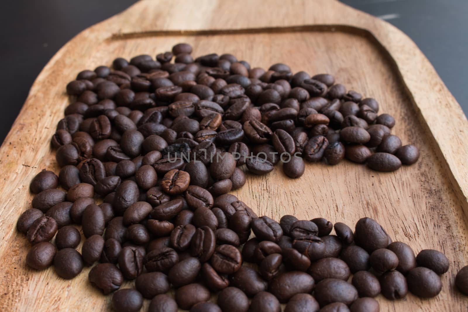 Coffee beans on the wooden floor