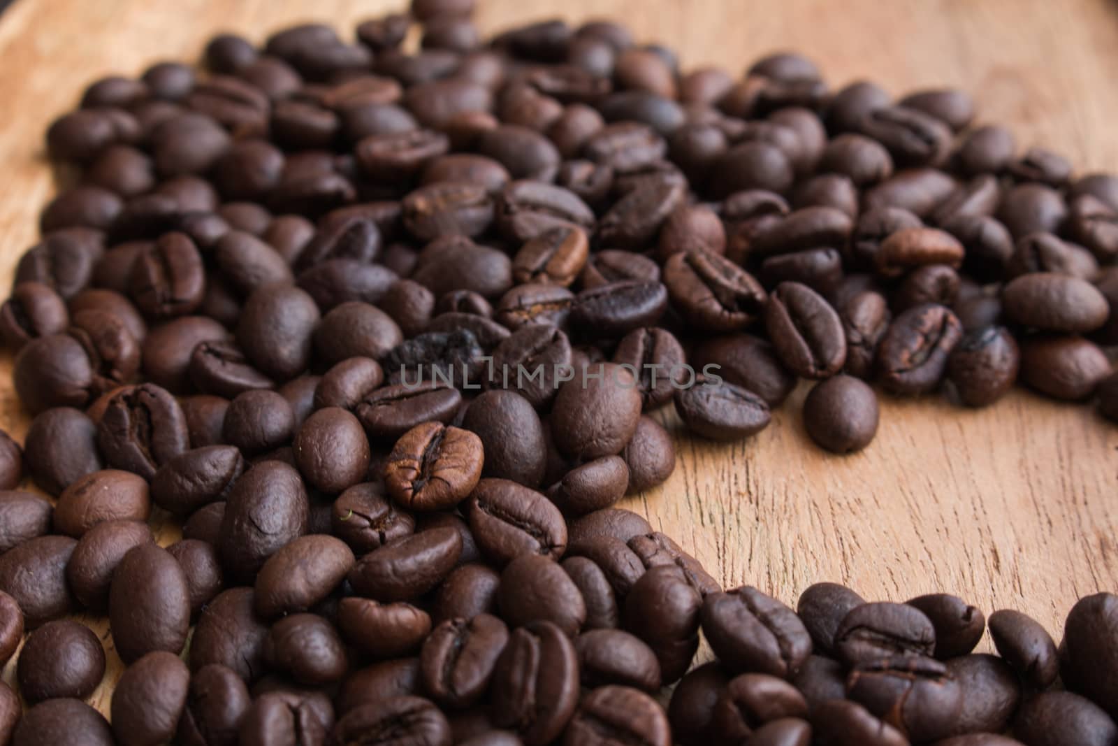 Coffee beans on the wooden floor