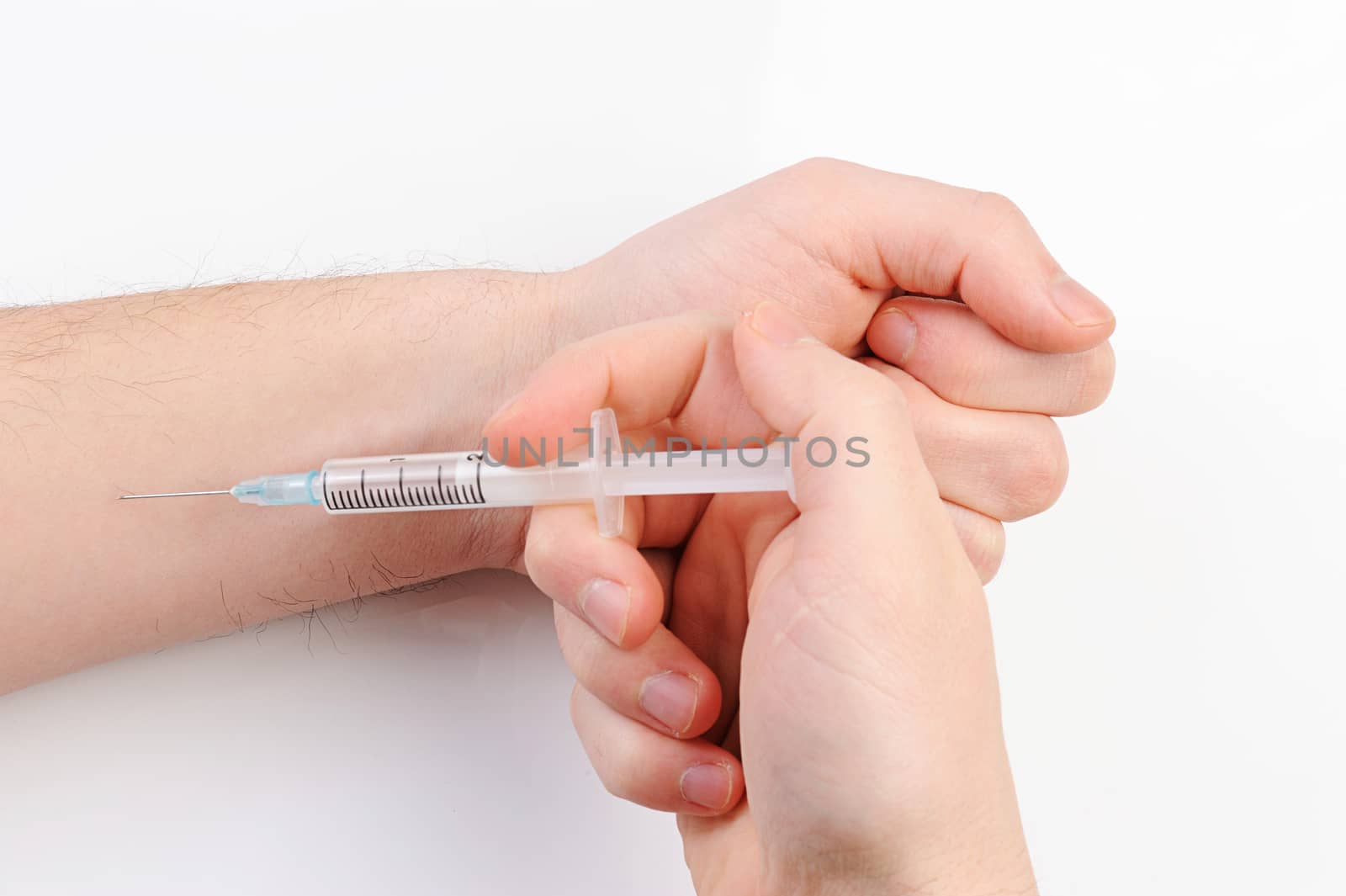 shot syringe in hand on white background