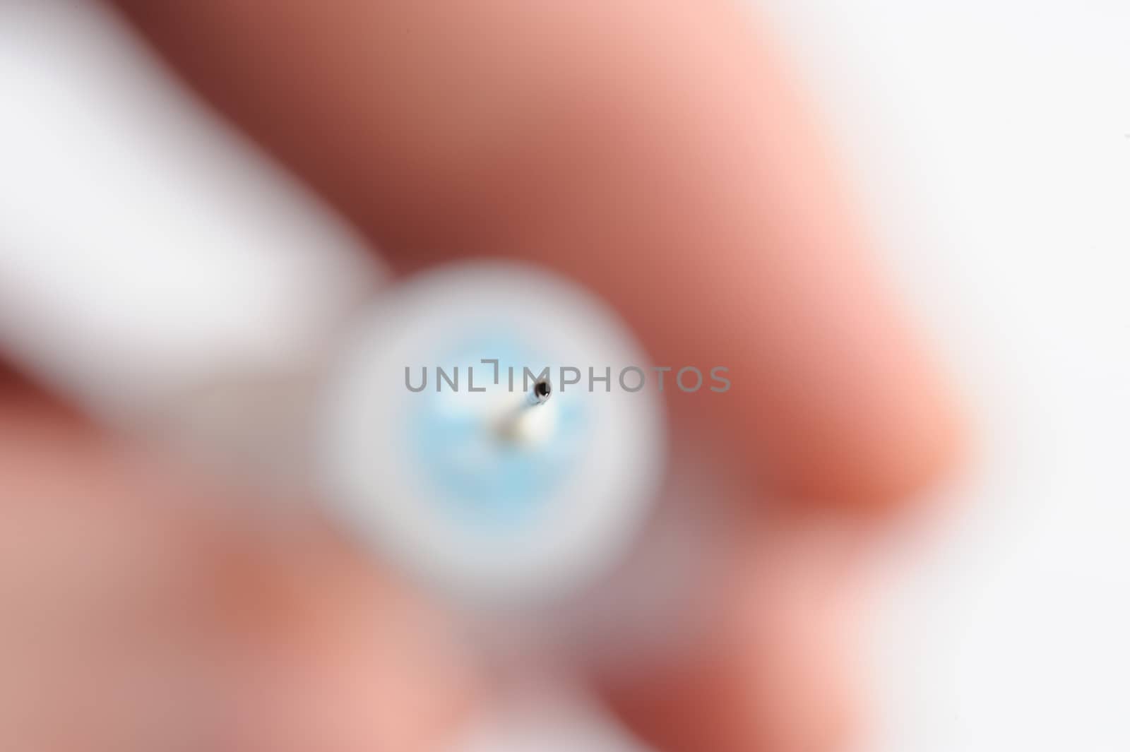 close up of needle in syringe on hand white