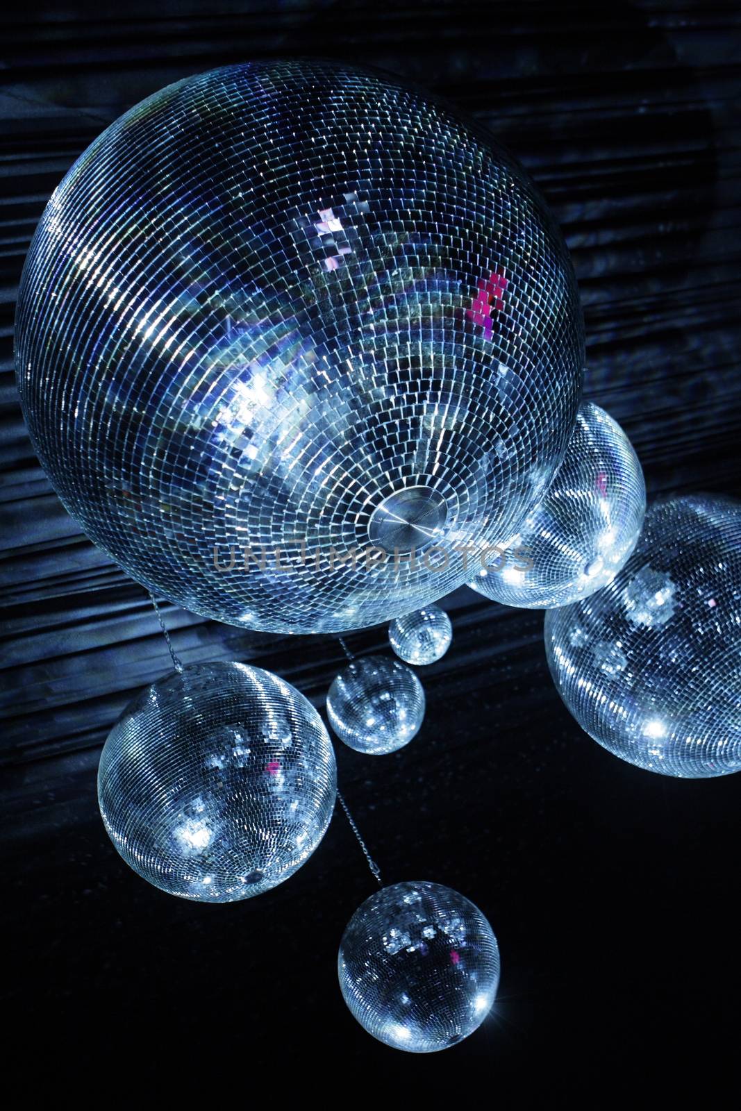 Shiny disco balls on a dark background