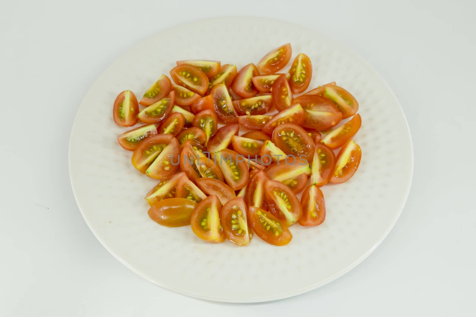 slices of cherry  tomatoes isolate on white background by art9858