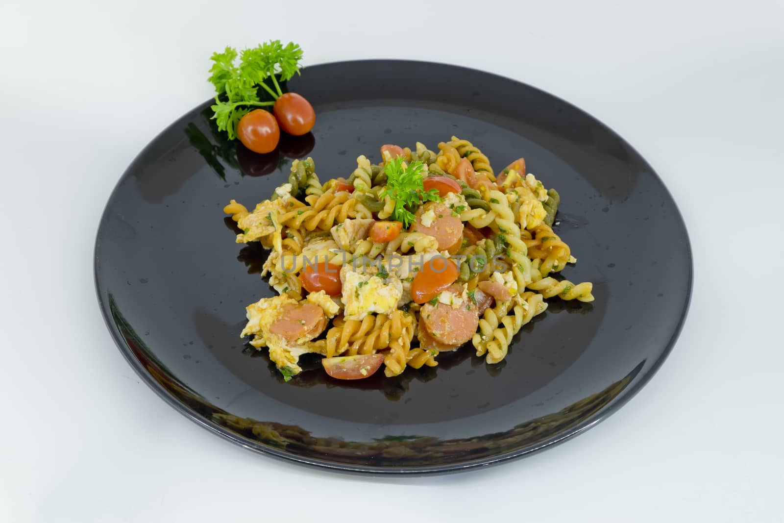 Macaroni pasta with tomato sauce and sausage on a black and whit by art9858