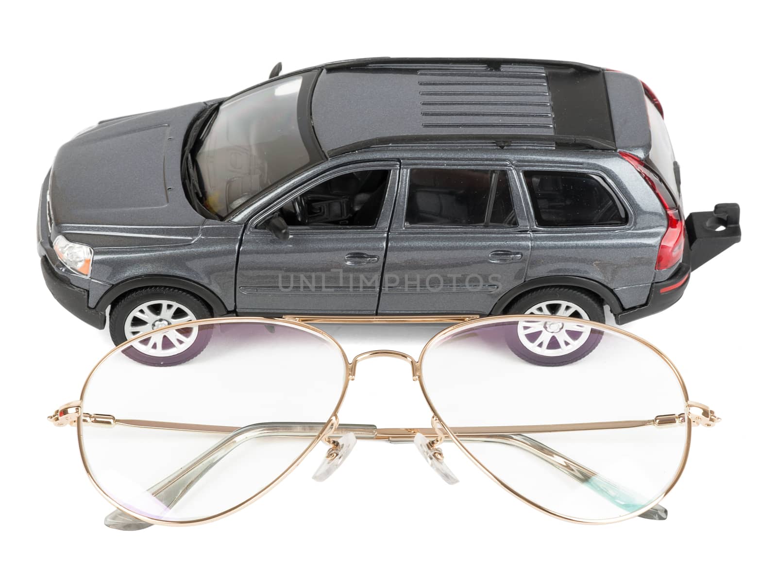 Car with glasses isolated on white background