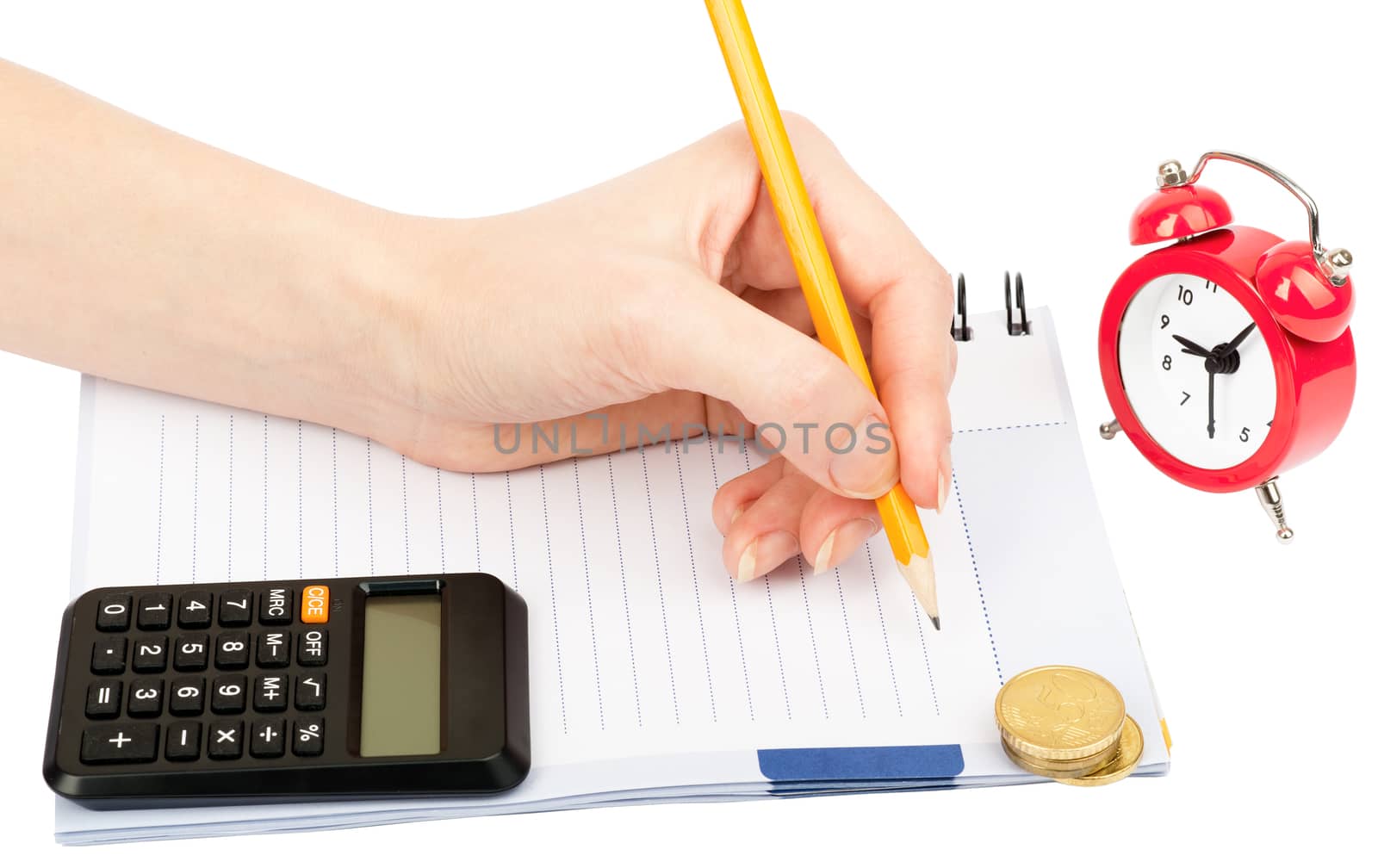 Females hand writing within pencil in notebook and calculator on isolated white background