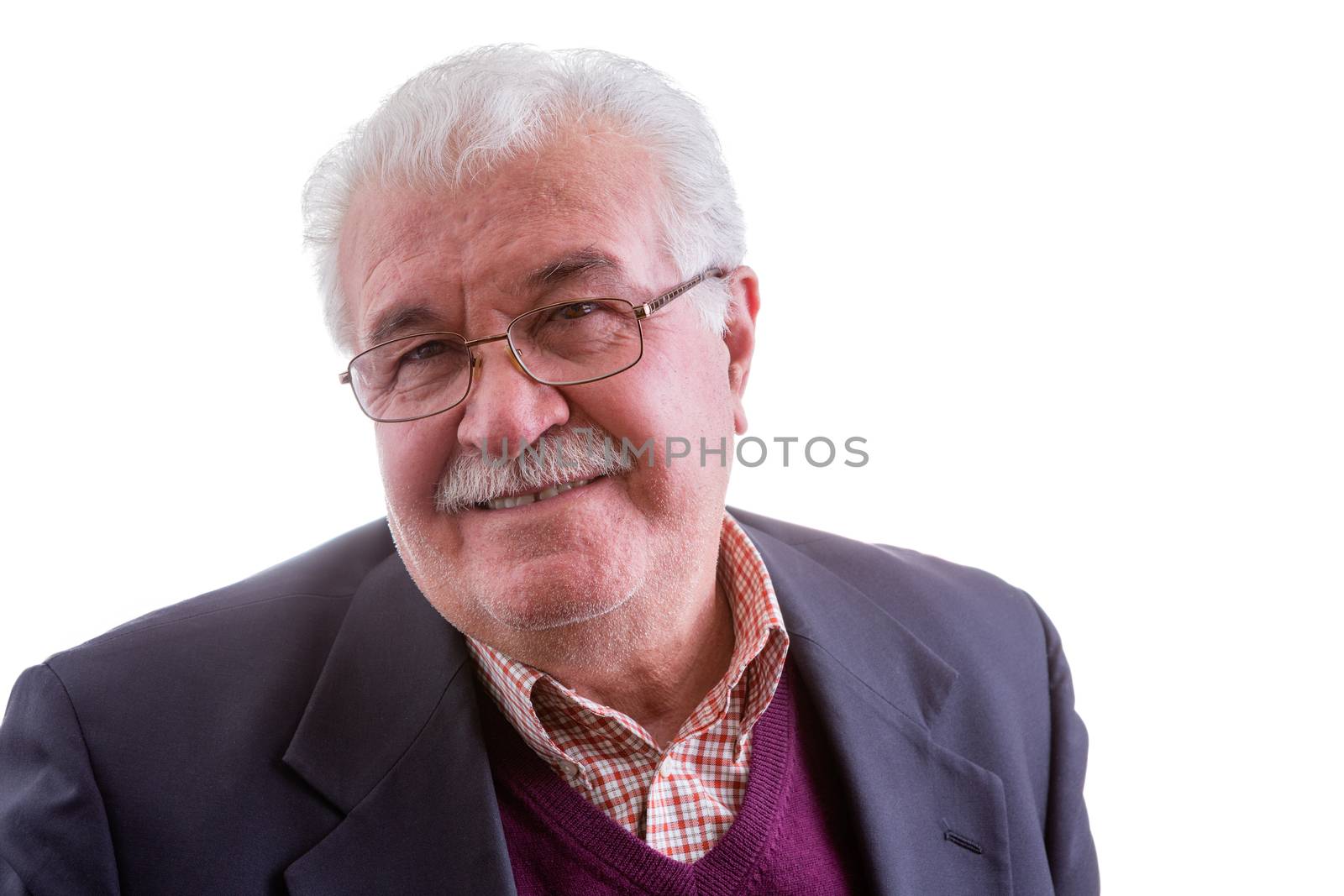 White-haired retired elderly gentleman looking at the camera with a genuine quiet smile, head and shoulders isolated on white