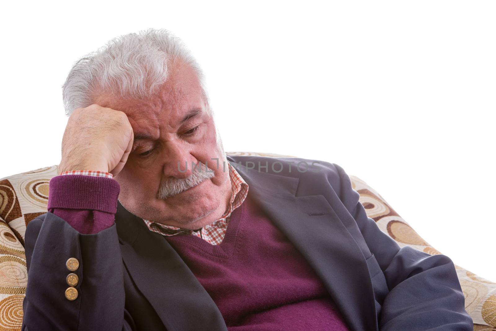 Tired elderly retired man sitting thinking by coskun