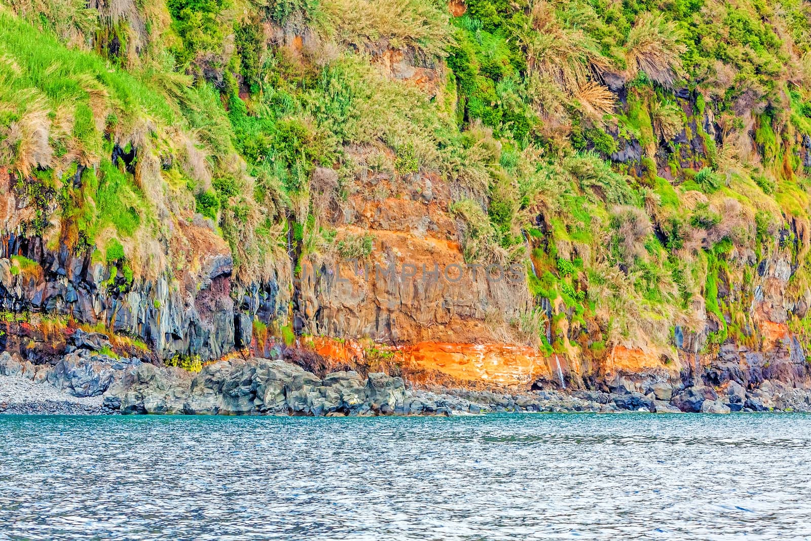 Colorful rocky cliff coast of Madeira by aldorado