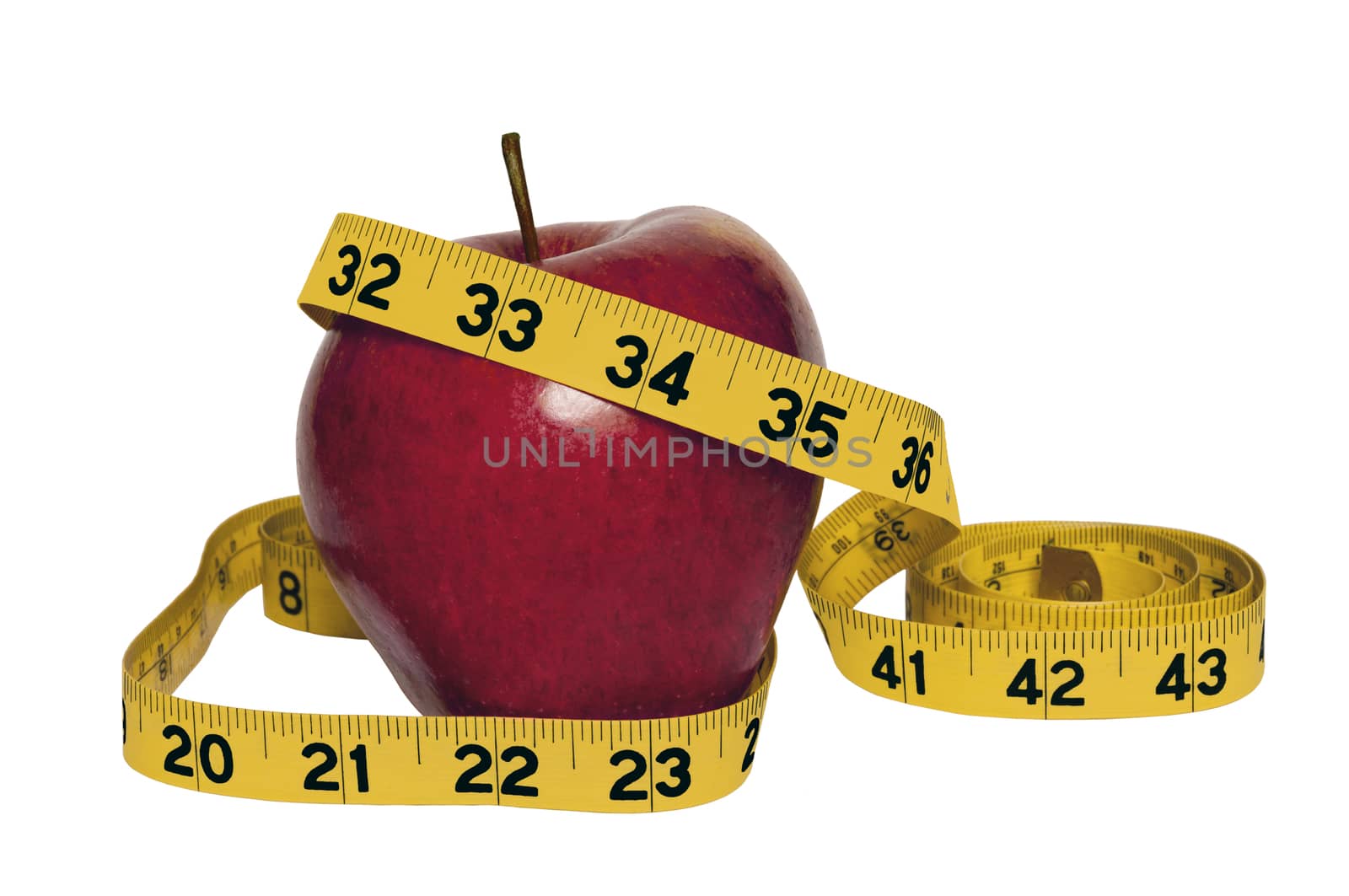 Horizontal shot of a delicious shiny red apple with a yellow tape measure. Concept of eating healthy and losing weight.  Isolated on white background