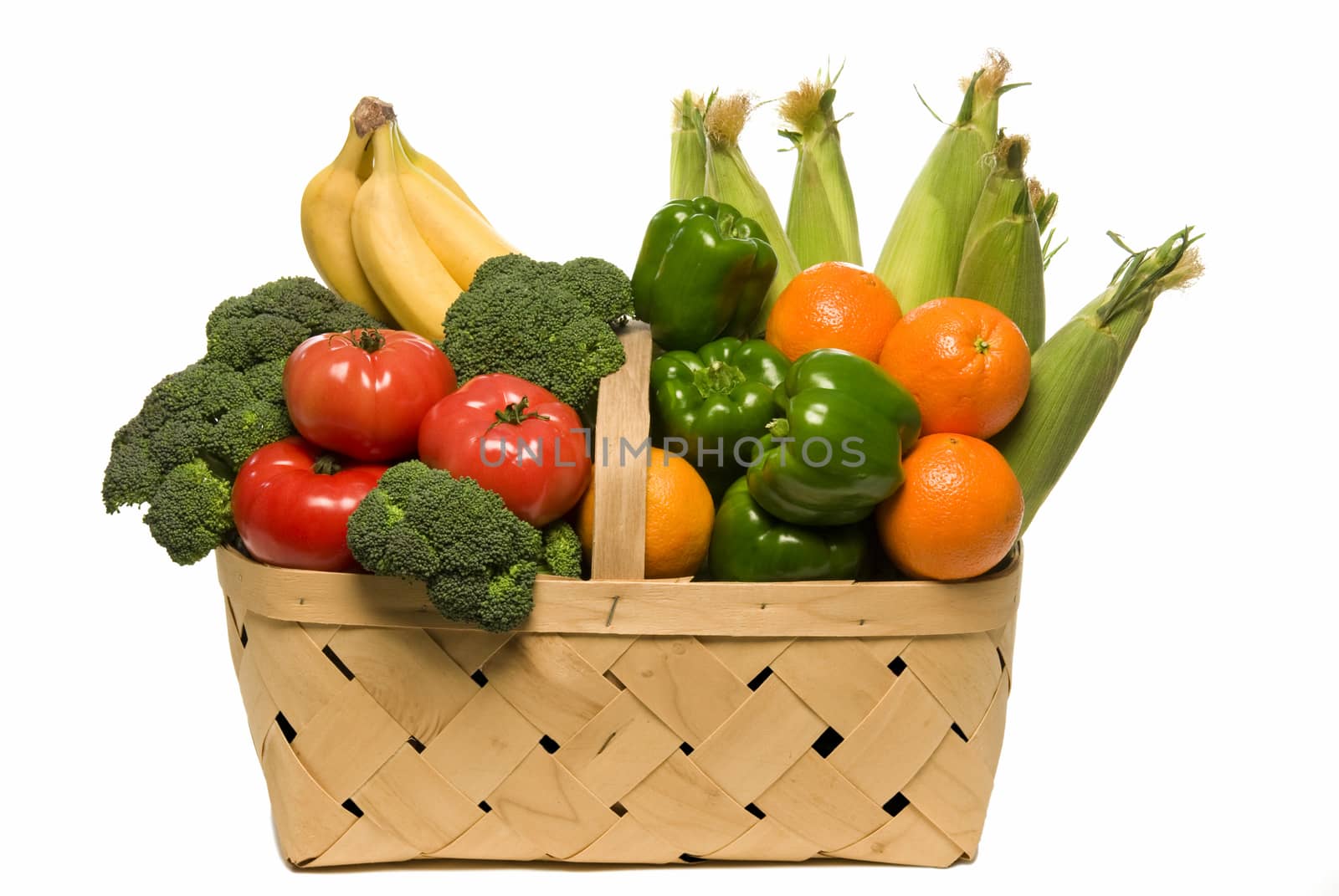 Fresh picked fruit and vegetables in basket and isolated on white background