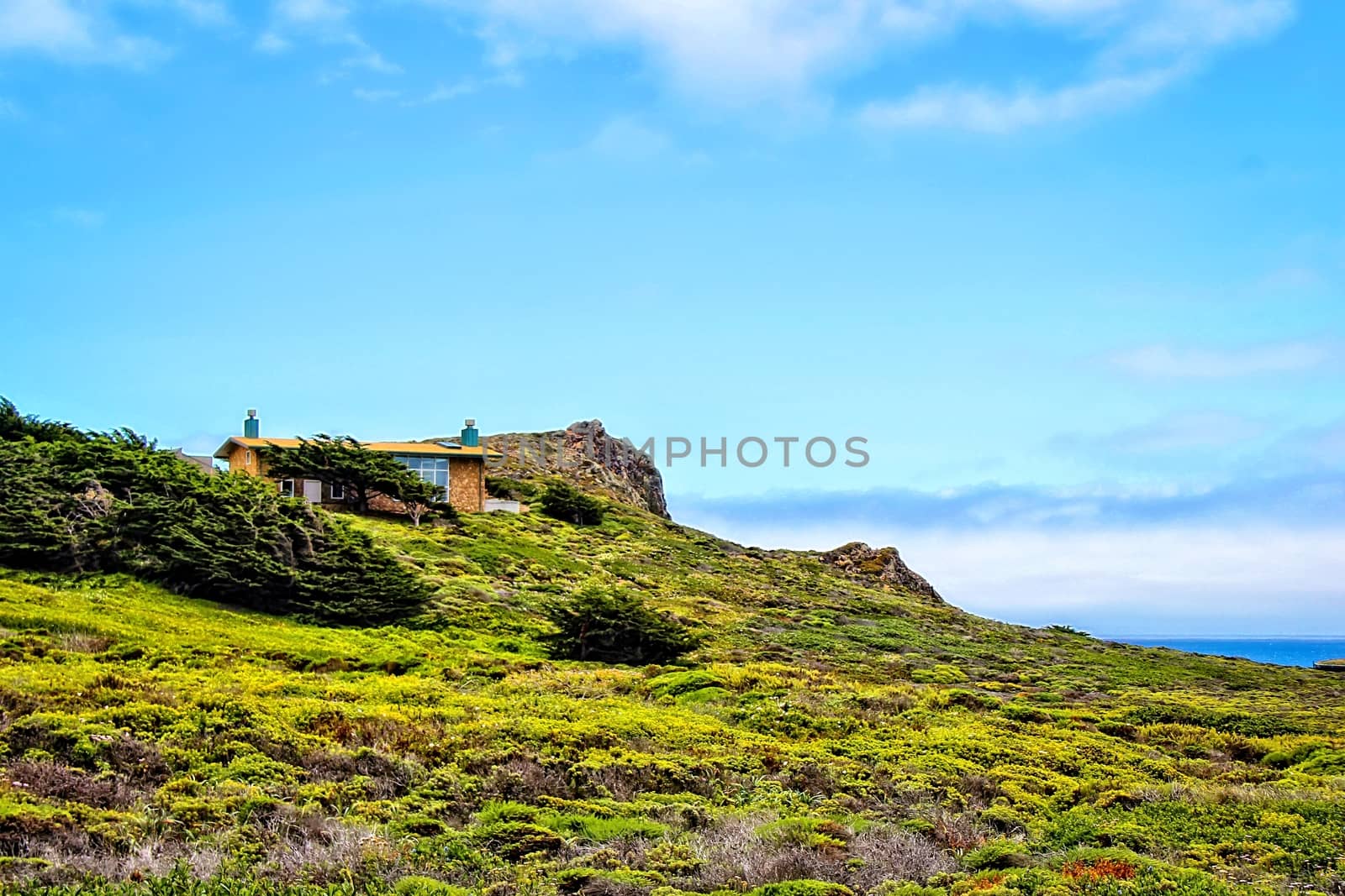 mountain view with blue sky and green grass