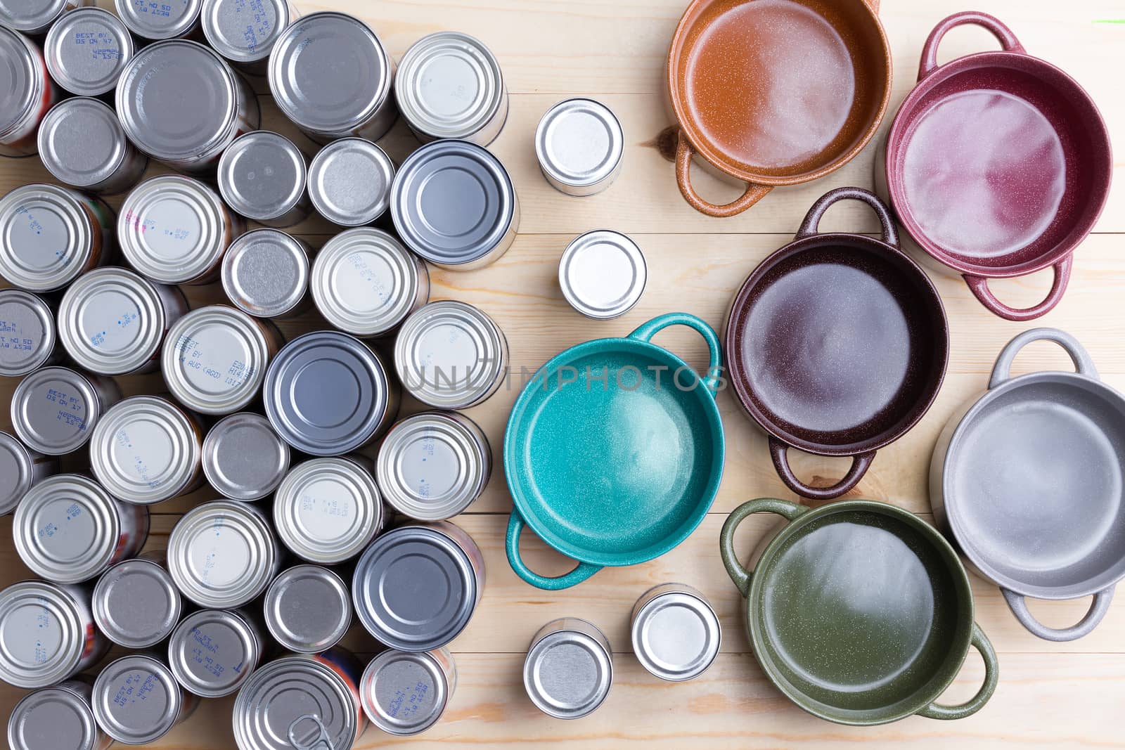 Top view of canned food and ceramic soup bowls