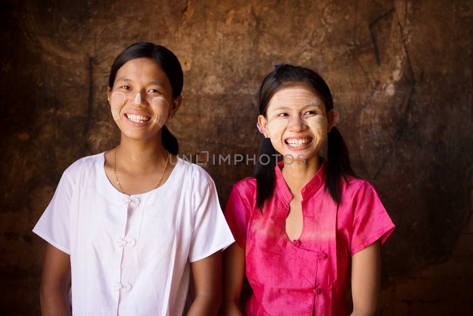 Portrait of beautiful young traditional Myanmar girls smiling. Close up head shot.