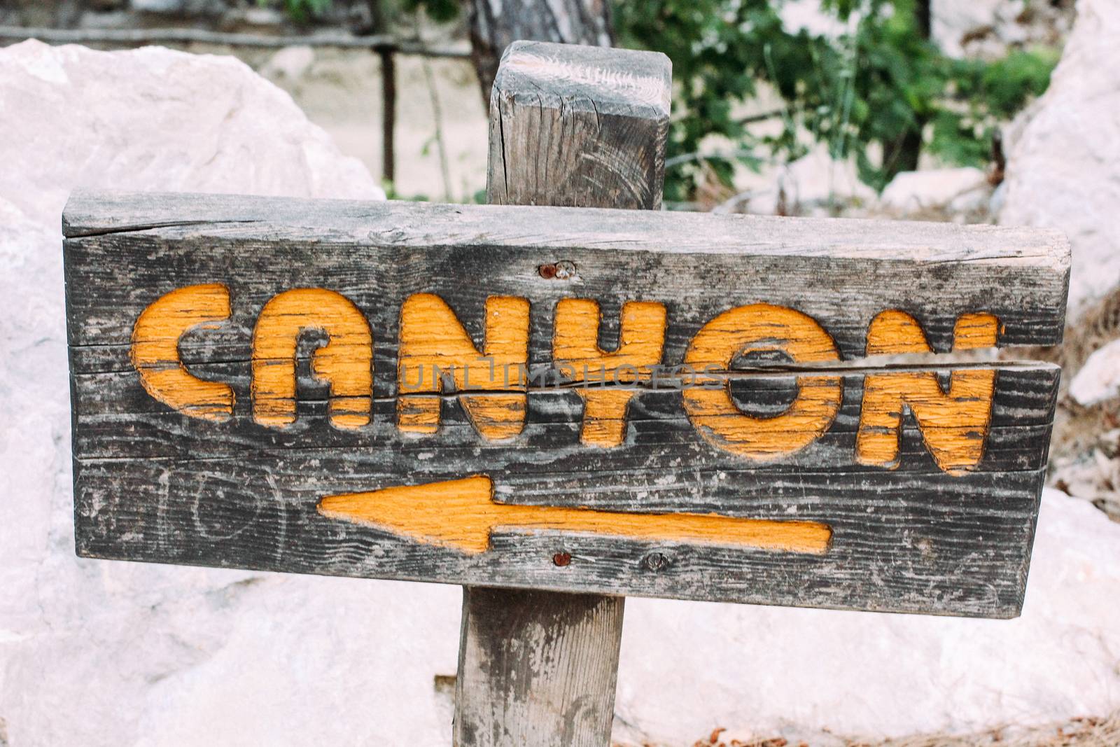 Wooden plaque with the inscription pointer Canyon. The National Park Canyon Goynuk, Turkey