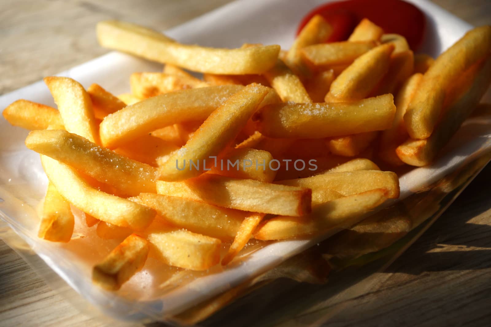 Golden French fries potatoes ready to be eaten by Noppharat_th