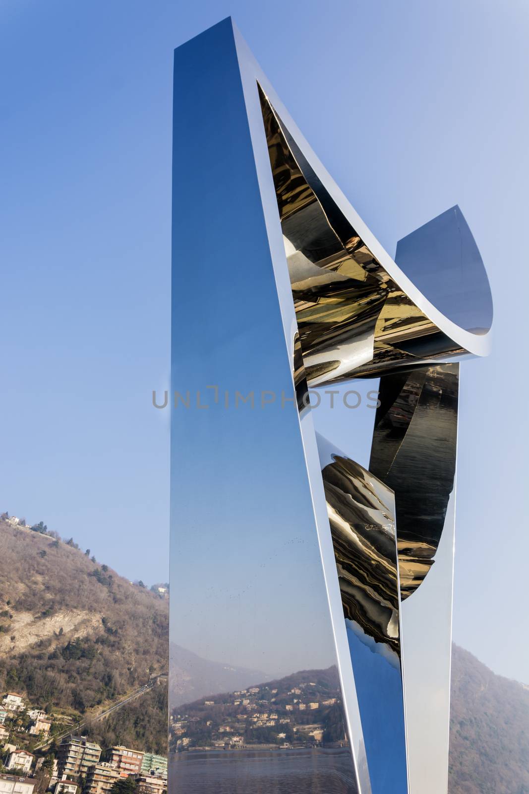 Como, Italy, january 1st 2016: Life Electric (also known as The Life Electric) is a contemporary sculpture, dedicated to the physicist Alessandro Volta (1745-1827). Completed in 2015 it is located in Como, Italy. Life Electric was designed by Daniel Libeskind, and was a gift to Como, the city where the architect located his “Summer Session” school of architecture, in 1988. The sculpture was commissioned by the non profit association “Gli amici di Como”. The design of the fountain illustrates the evolution of modern architecture that took place over the period from 1920s to modern days, with the emergence of Rationalism. Libeskind’s creation has carried on the tradition of contemporary art in Como, and raised it's profile.