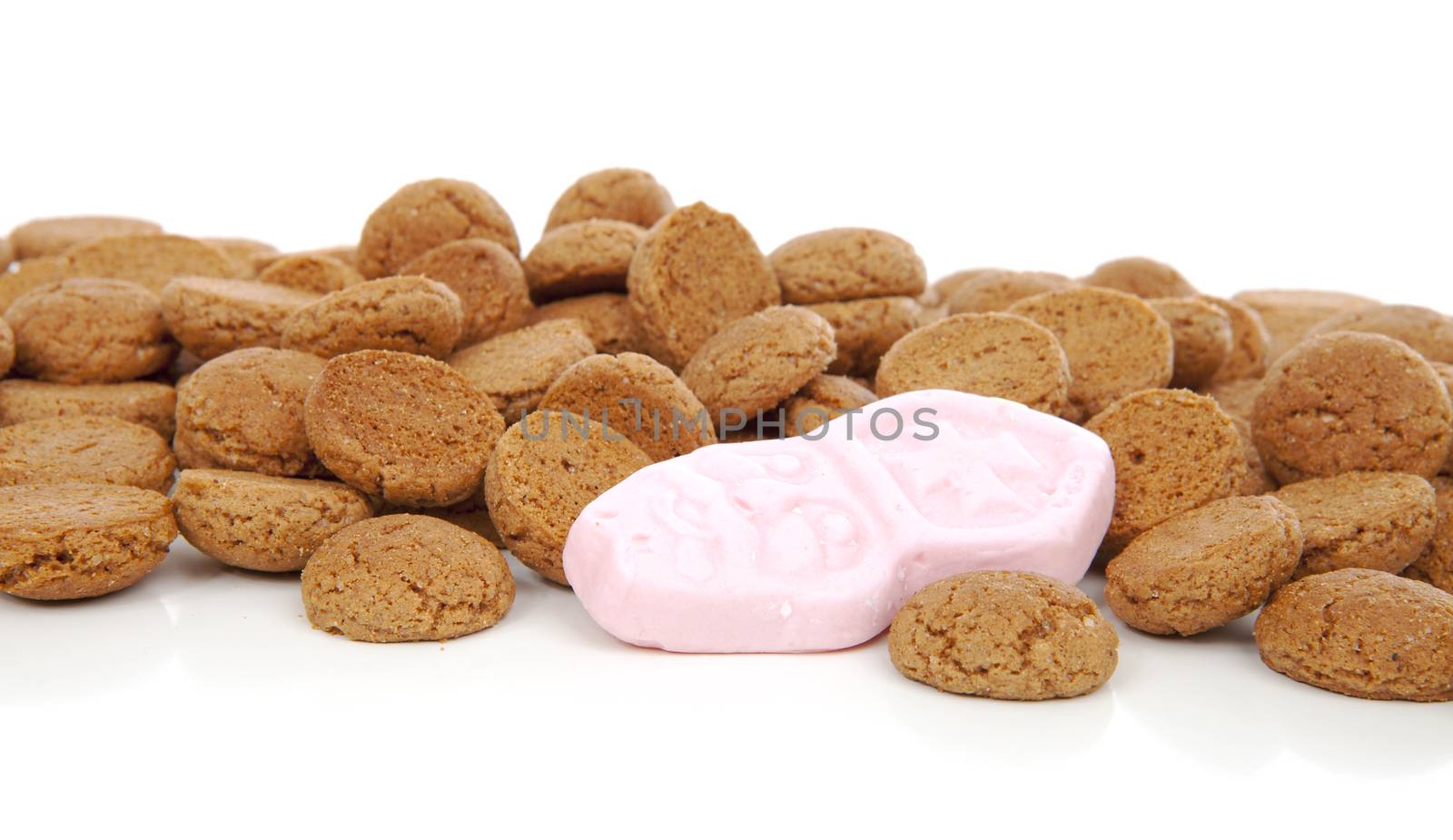 Closeup of typical Dutch sweets: pepernoten (ginger nuts) for Sinterklaas; celebration at 5 december in the Netherlands over white background