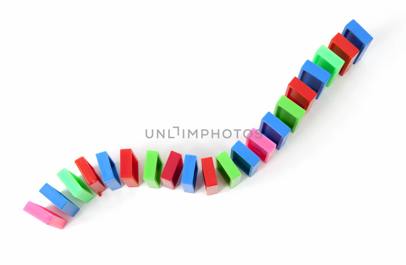 colorful domino bricks in a row isolated on white background