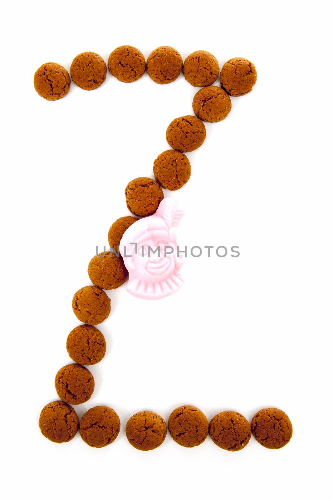 Ginger nuts, pepernoten, in the shape of letter Z isolated on white background. Typical Dutch candy for Sinterklaas event in december