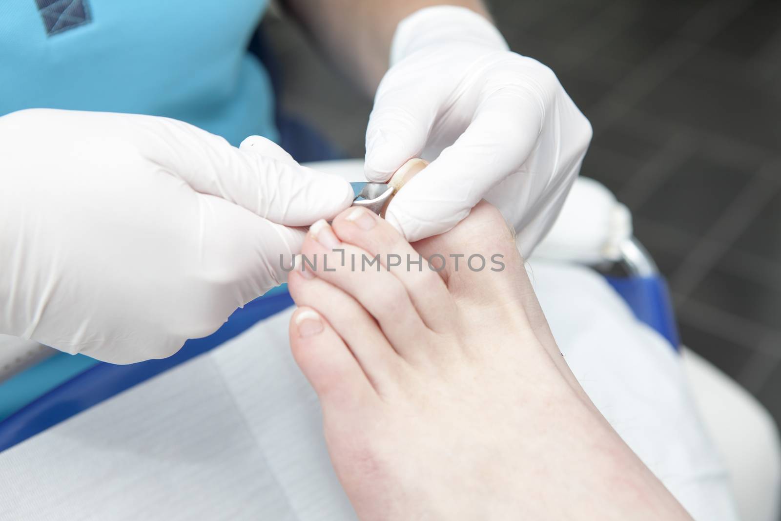 Cutting toe nails by pedicure in closeup