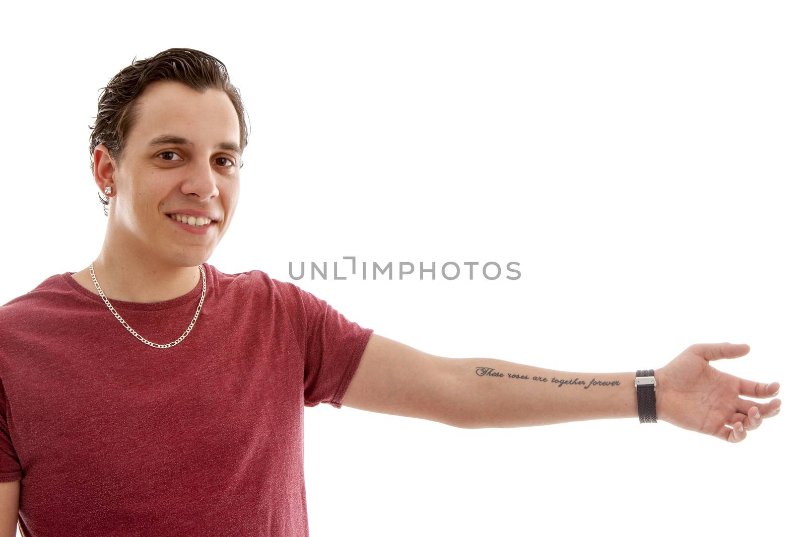 Young man is showing his tattoo on arm over white background