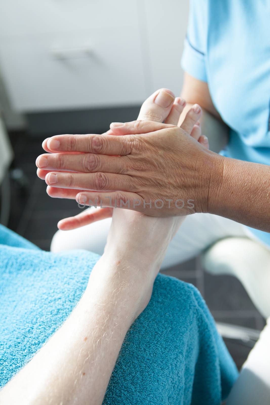 Massage of feet by pedicure