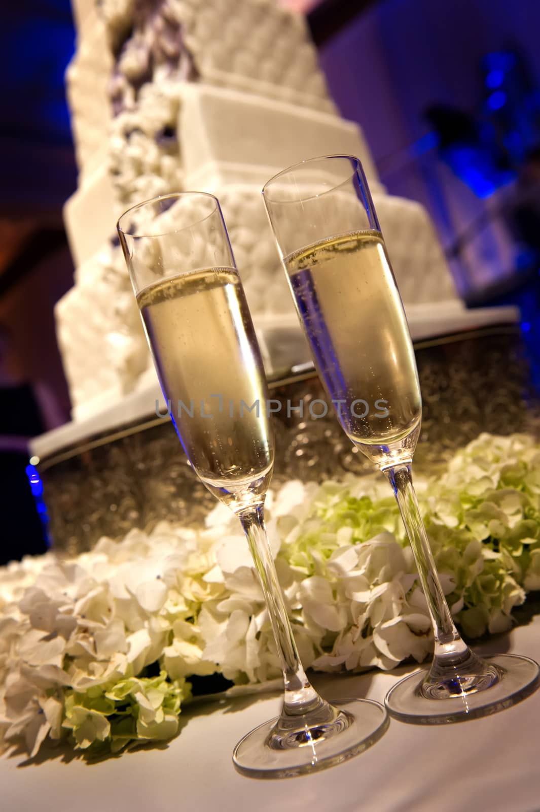 Image of toasting champagne flutes at a wedding