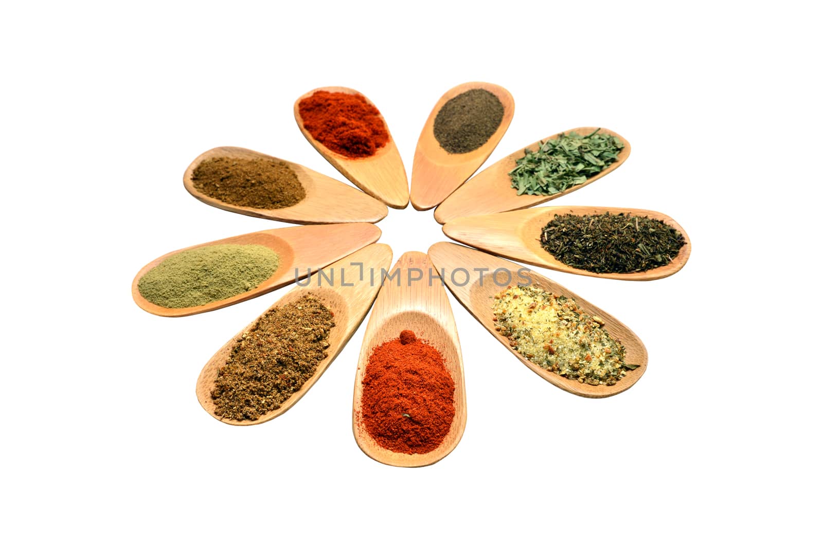 wooden food spice spoons over white background