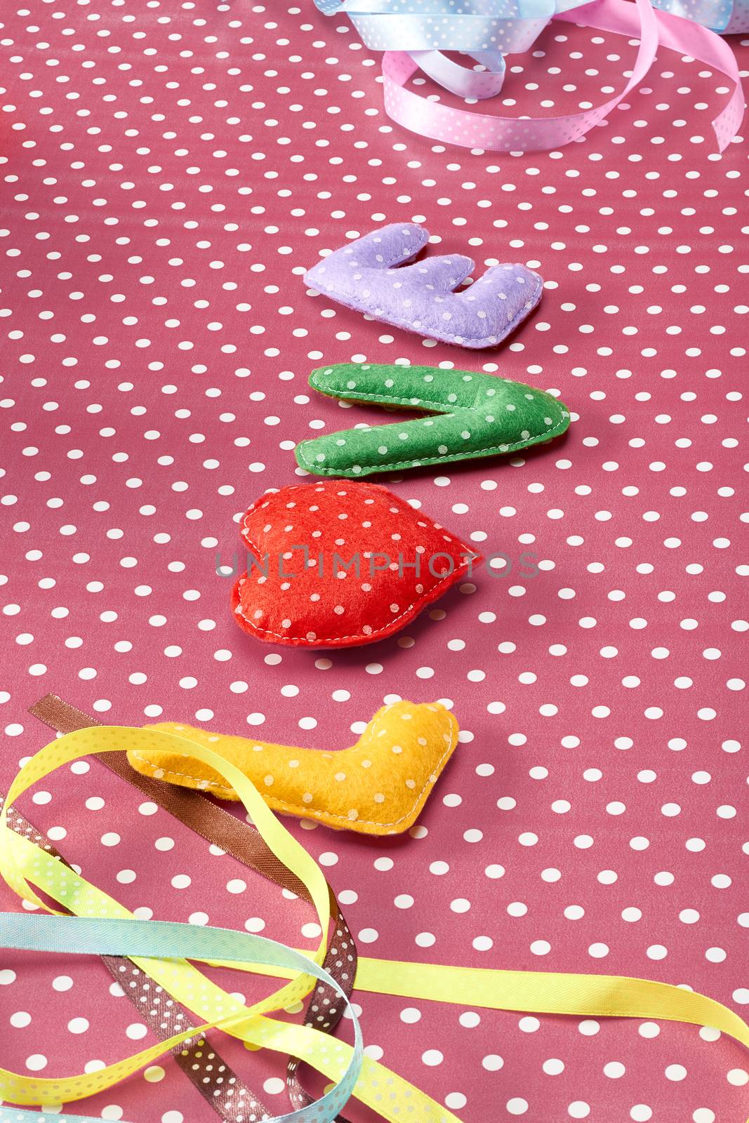 Love, Valentines Day. Word Love polka dots, red heart Handmade, ribbons. Retro vintage romantic style, toned. Vivid unusual creative art greeting card, multicolored felt, present, copyspace