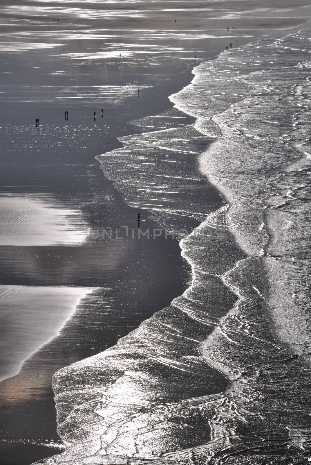 Surfers at Saunton Sands by dpe123