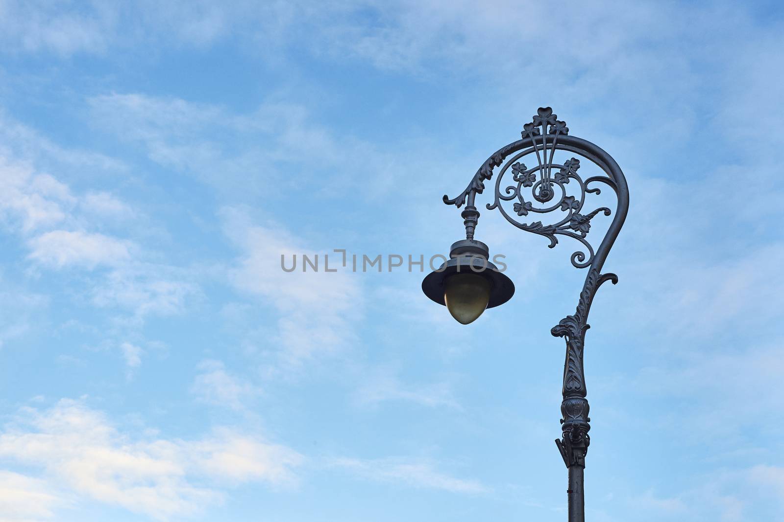 DUBLIN, IRELAND - JANUARY 05: Lamp post decorated with shamrock shape against blue sky. January 05, 2016 in Dublin
