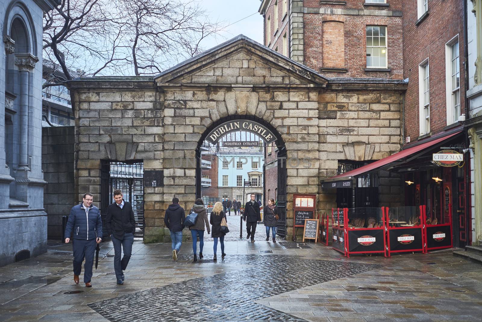 DUBLIN, IRELAND - JANUARY 05: Pedestrians walking in front of Dublin Castle gates. January 05, 2016 in Dublin