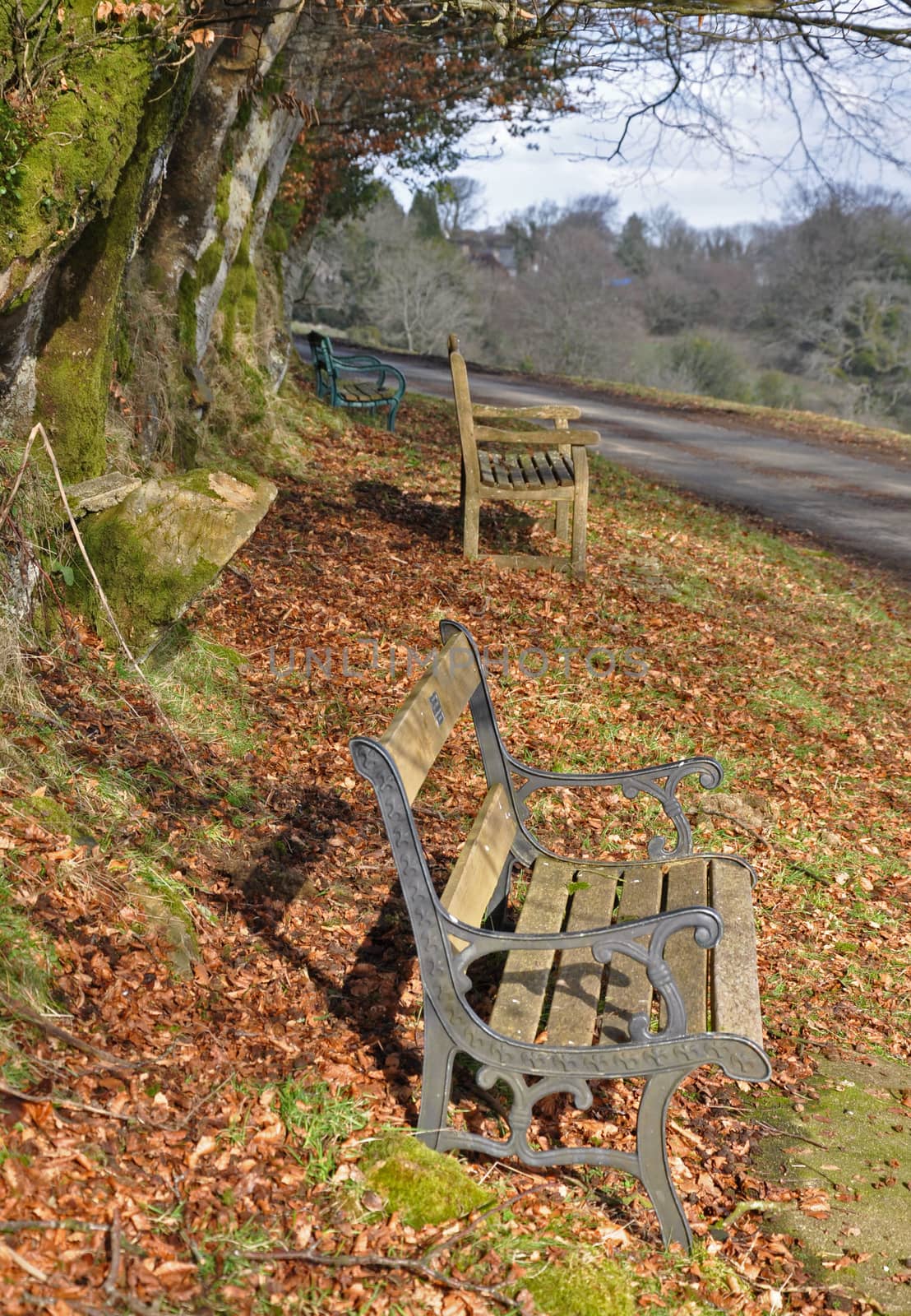 These weathered wooden bench is on the verge next to the village of Belstone, Dartmoor, Devon, England