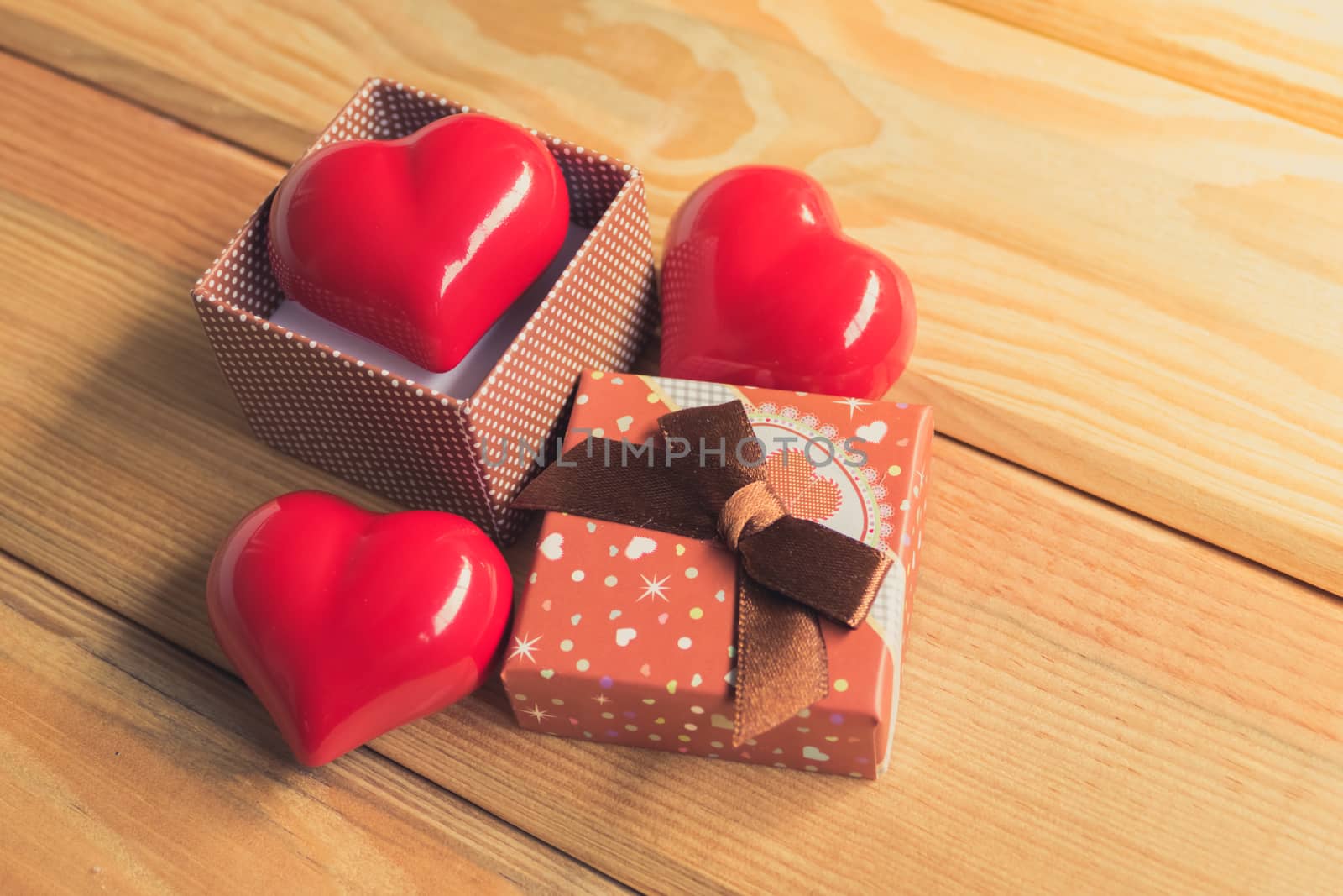 Gift of love. hearty gift. A gift box with a red heart inside. by teerawit