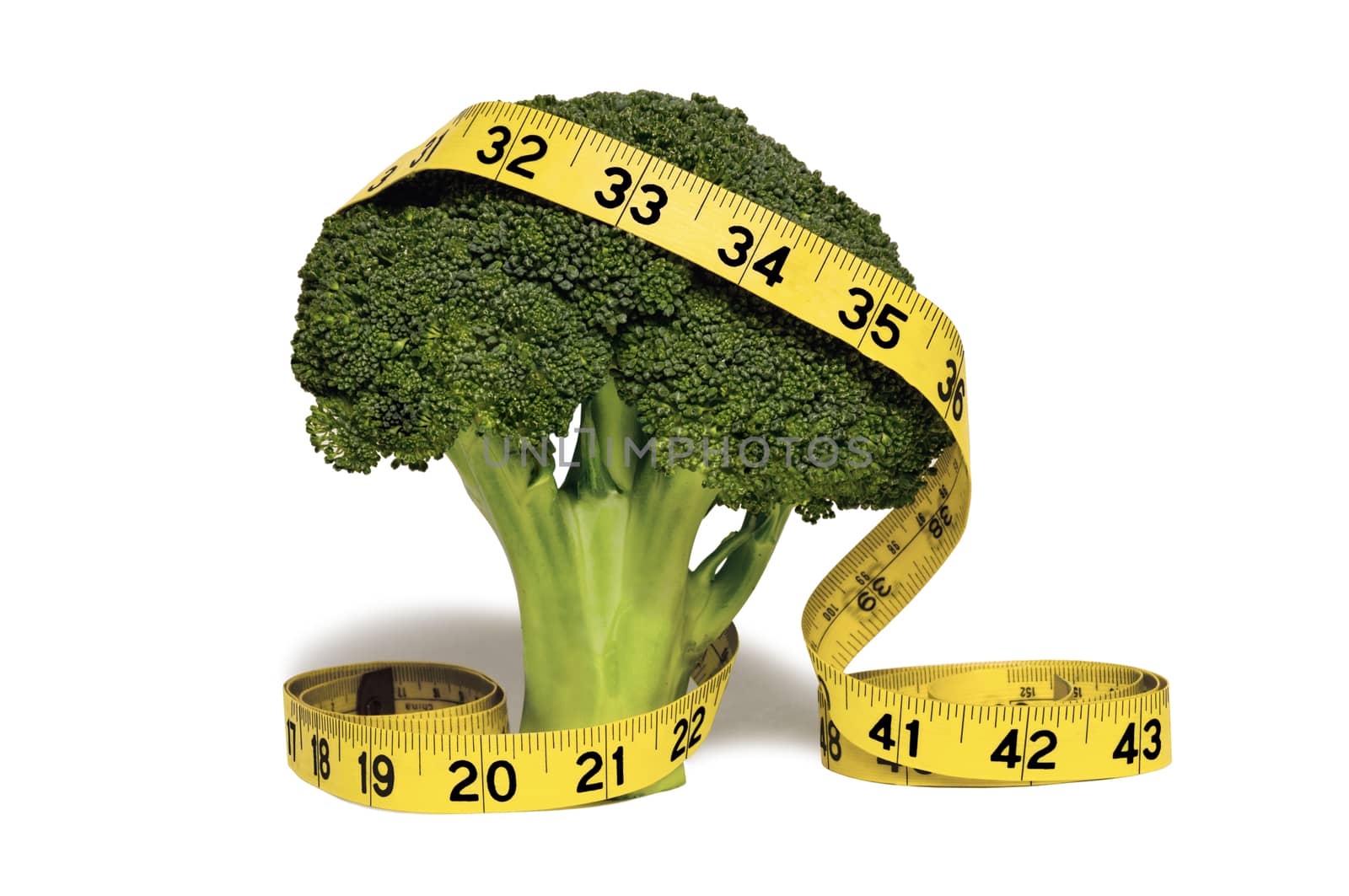 Beautiful broccoli with yellow measuring tape draped over it with the concept of eat healthy broccoli and lose weight