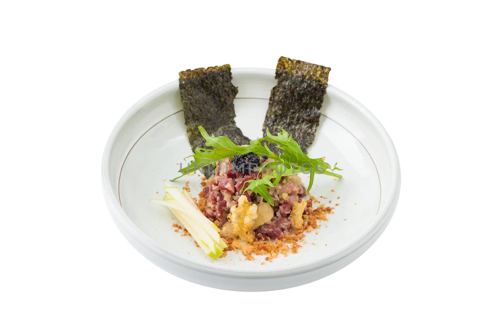 Raw dry-aged beef with herbs, seaweed and soup, Modern cuisine in Japanese style isolated on white background with clipping path