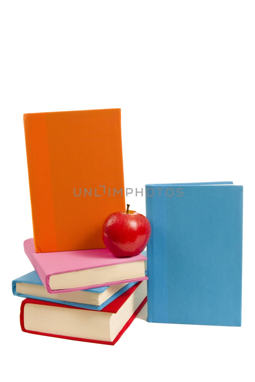 Set of covered blank books with a red apple.  Concept of reading is healthy for your mind.